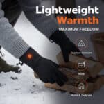 Heated gloves stacking firewood in the snow, black insulated gloves with built in heating for outdoor work and daily cold weather use.