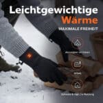 Lifestylebild von beheizten Handschuhen mit LED Wärmeanzeige beim Holzstapeln im Schnee, geeignet für Outdoor Aktivitäten, Arbeit und täglichen Einsatz